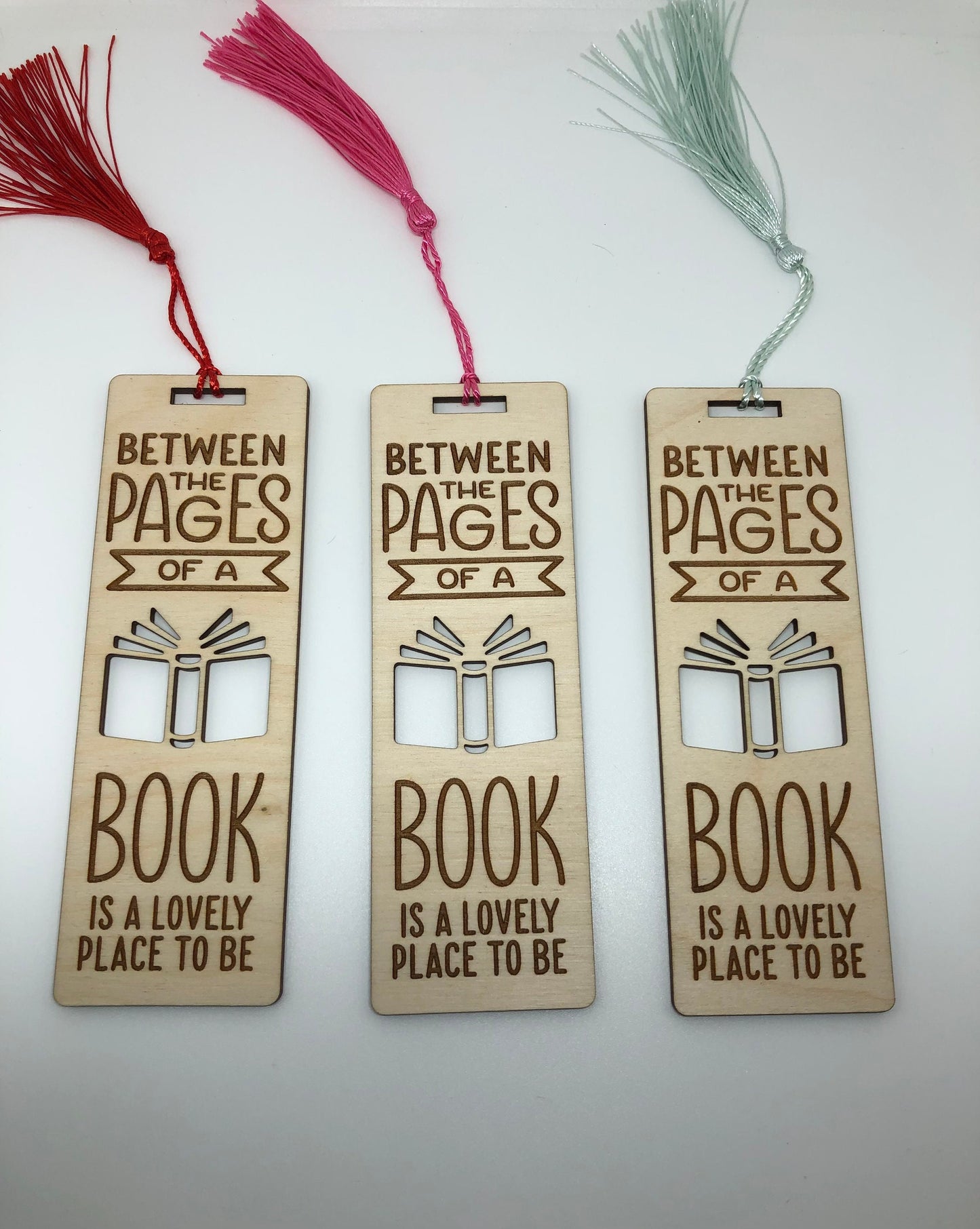 Between the pages of a book is a lovely place to be Engraved Wooden Bookmark