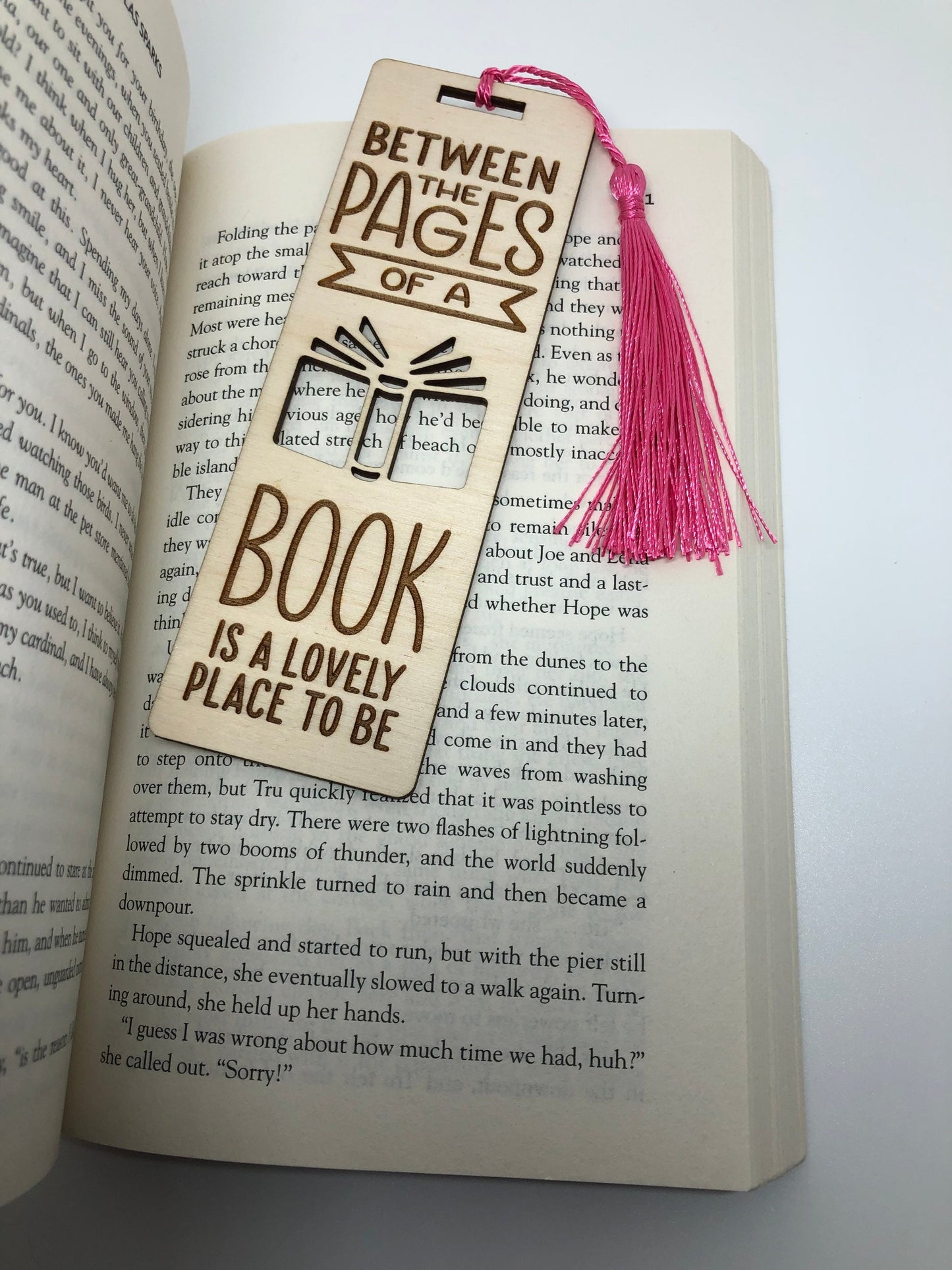 Between the pages of a book is a lovely place to be Engraved Wooden Bookmark