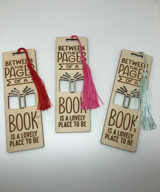 Between the pages of a book is a lovely place to be Engraved Wooden Bookmark