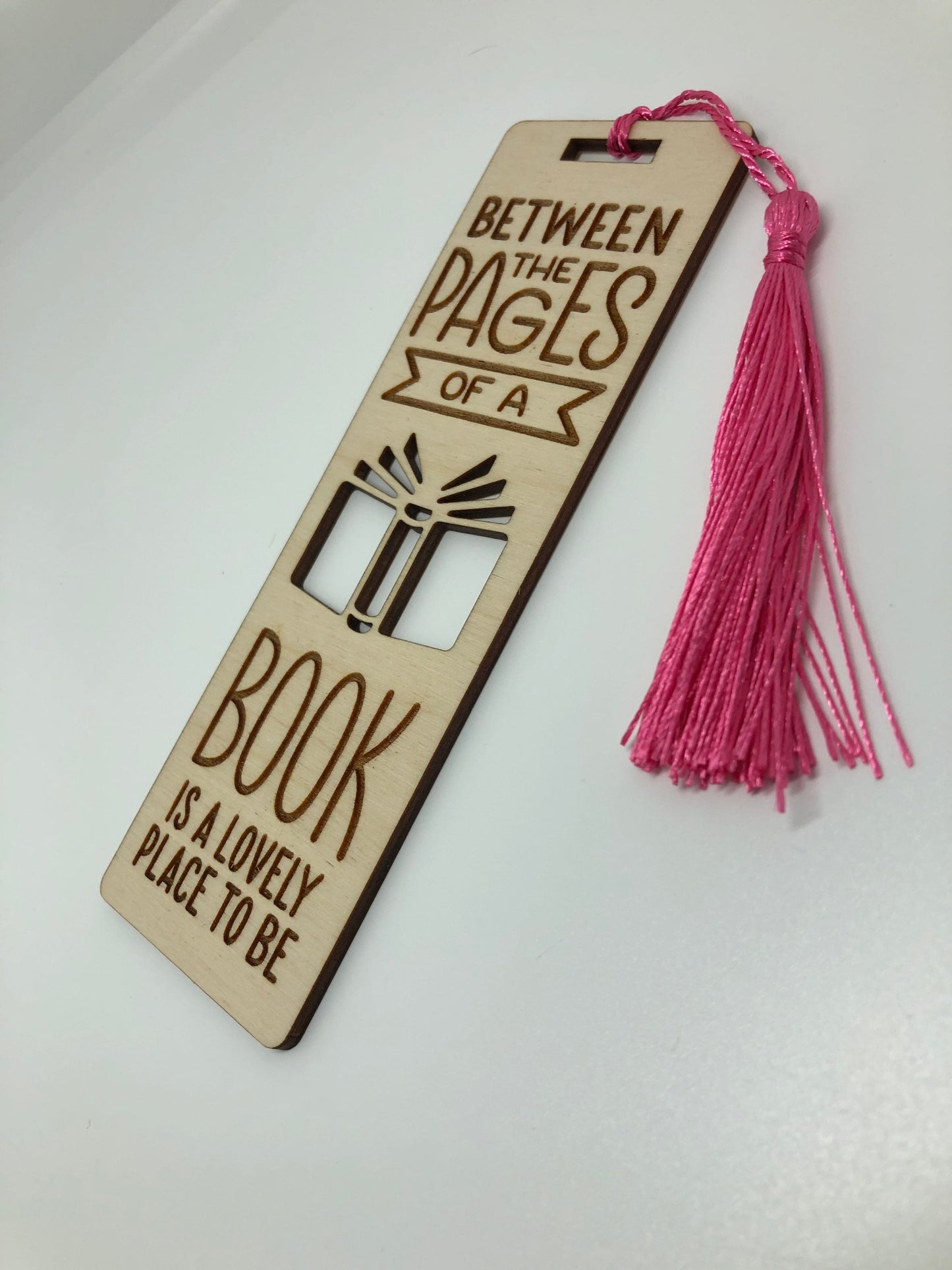 Between the pages of a book is a lovely place to be Engraved Wooden Bookmark